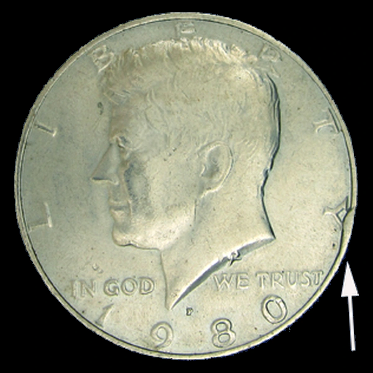 1980 Kennedy Half Dollar: obverse rim cud