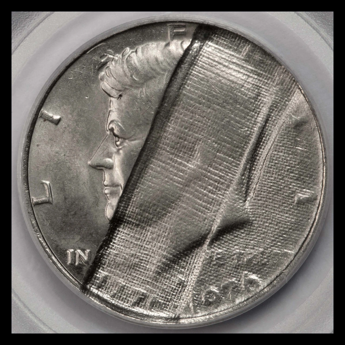 1976 Kennedy Half Dollar: Struck Through Cloth