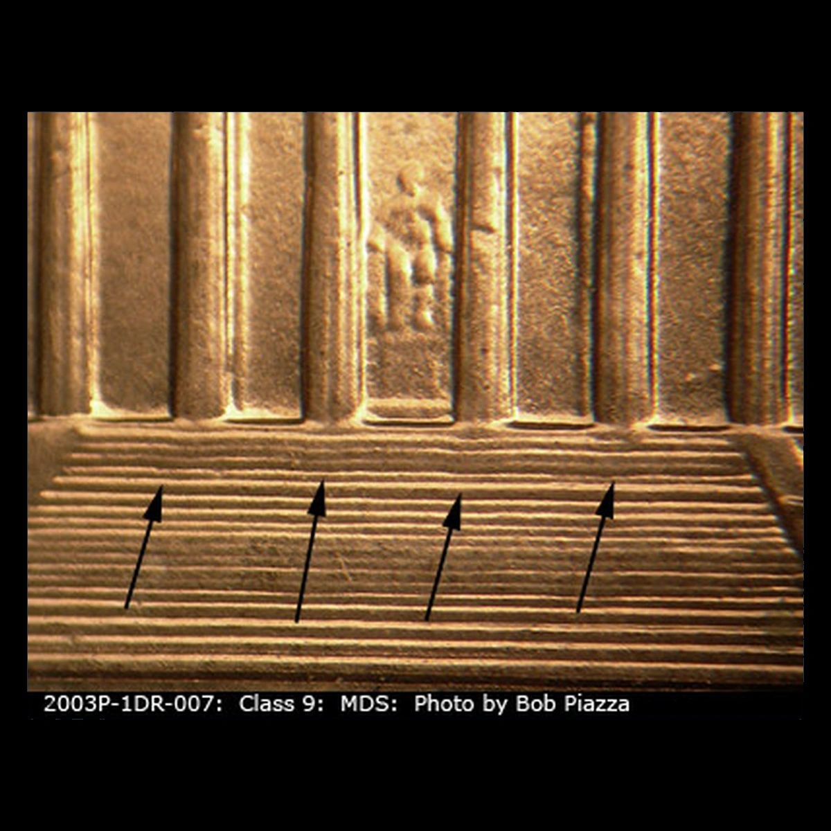 2003 Lincoln Cent (Modern): wavy steps from a design-extension anomaly