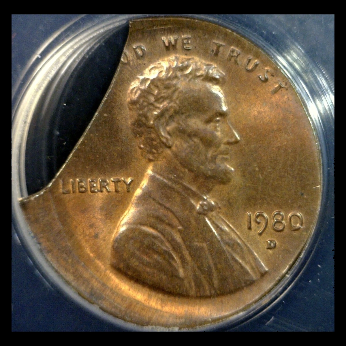 1980 Lincoln Penny: Curved Clip with Off-Center Strike