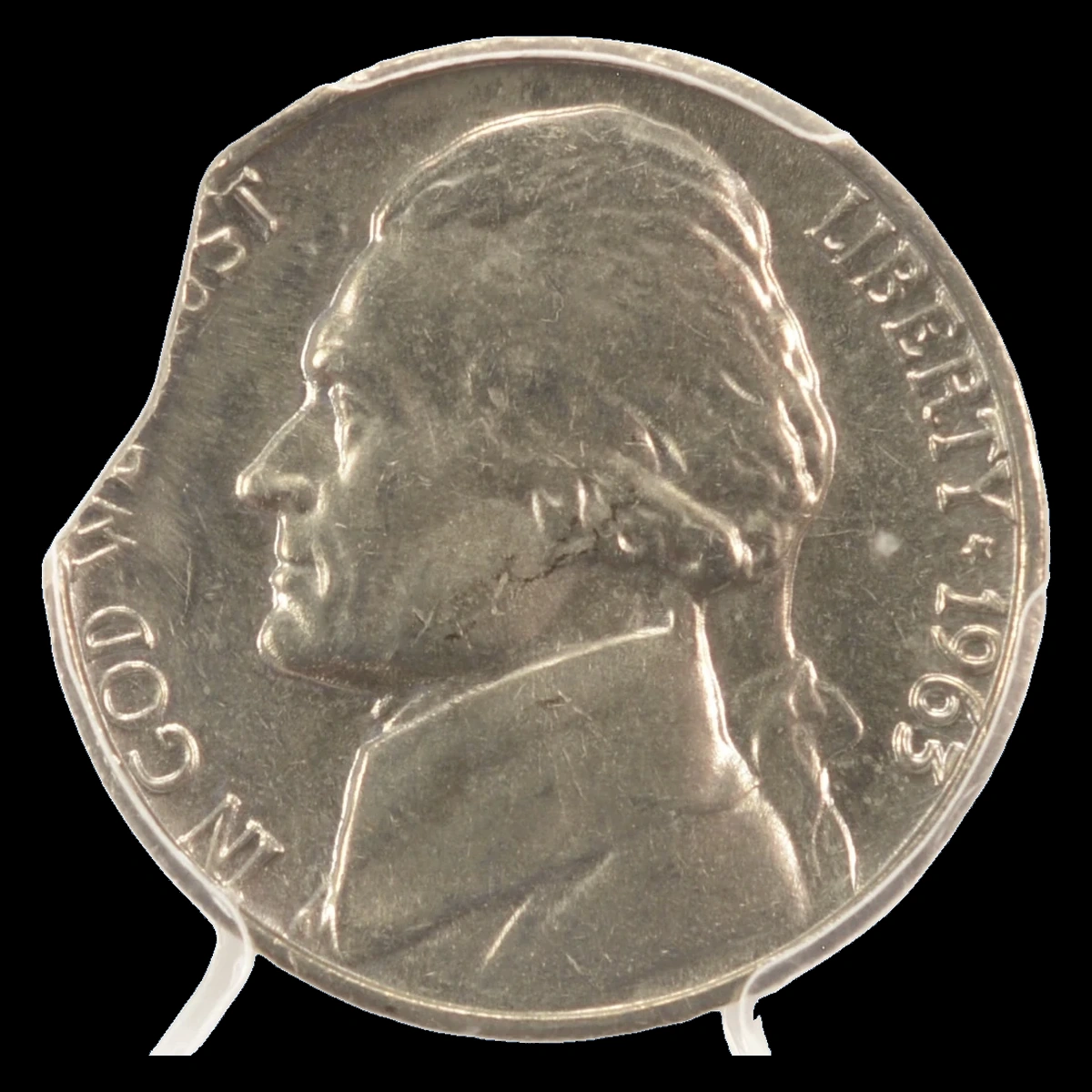 1963 Jefferson Nickel: Curved clipped planchet