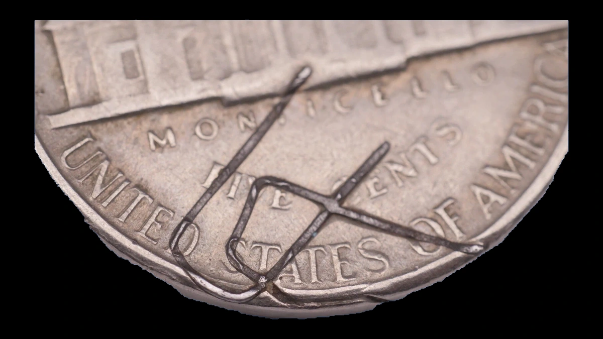 1959 Jefferson Nickel: Staple struck into reverse