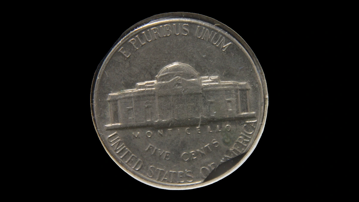 1967 Jefferson Nickel: Incomplete and curved clip