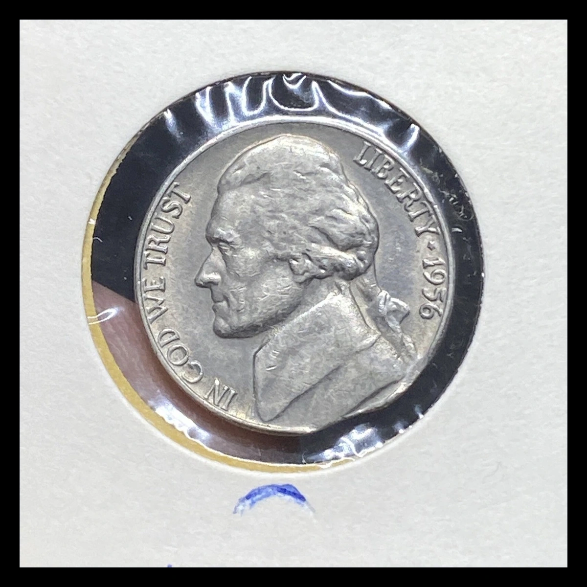 1956 Jefferson Nickel: Curved clipped planchet