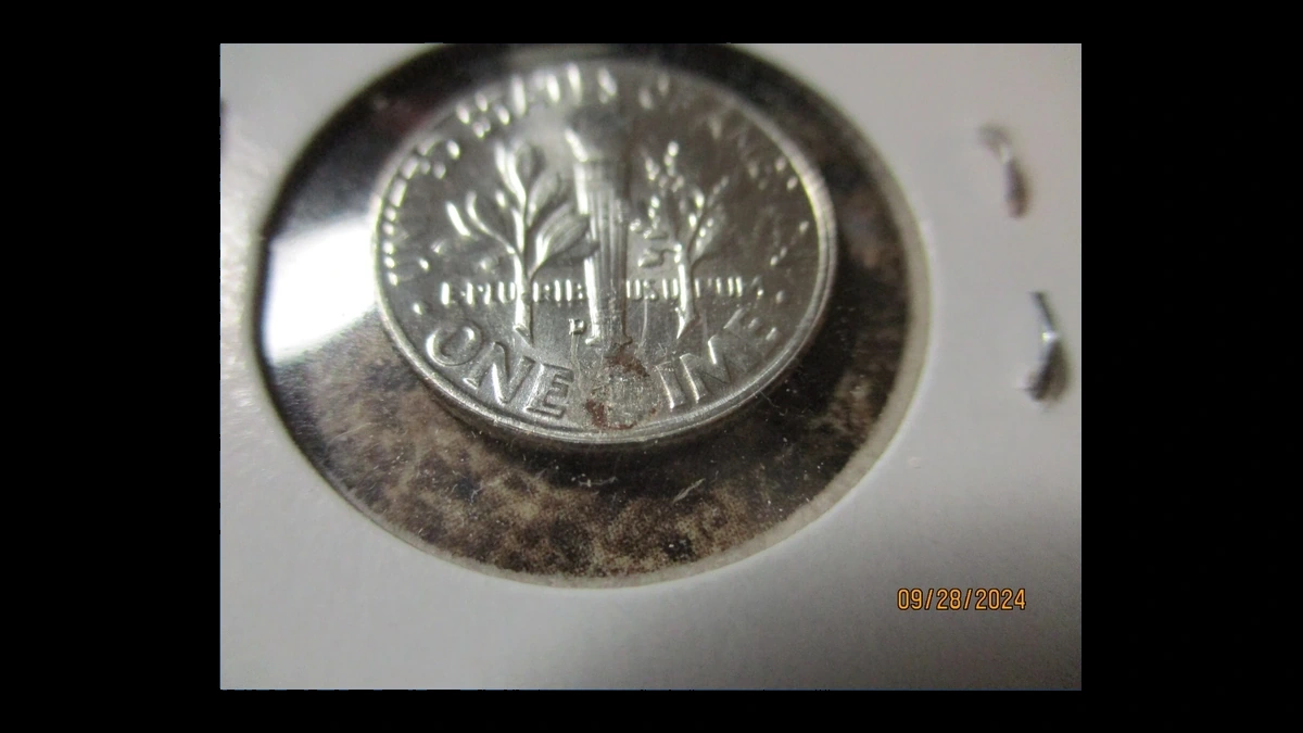 1957 Roosevelt Dime: Struck Through