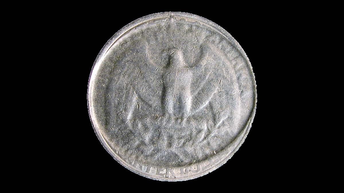 1998 Washington Quarter: strike through an elliptical clad layer