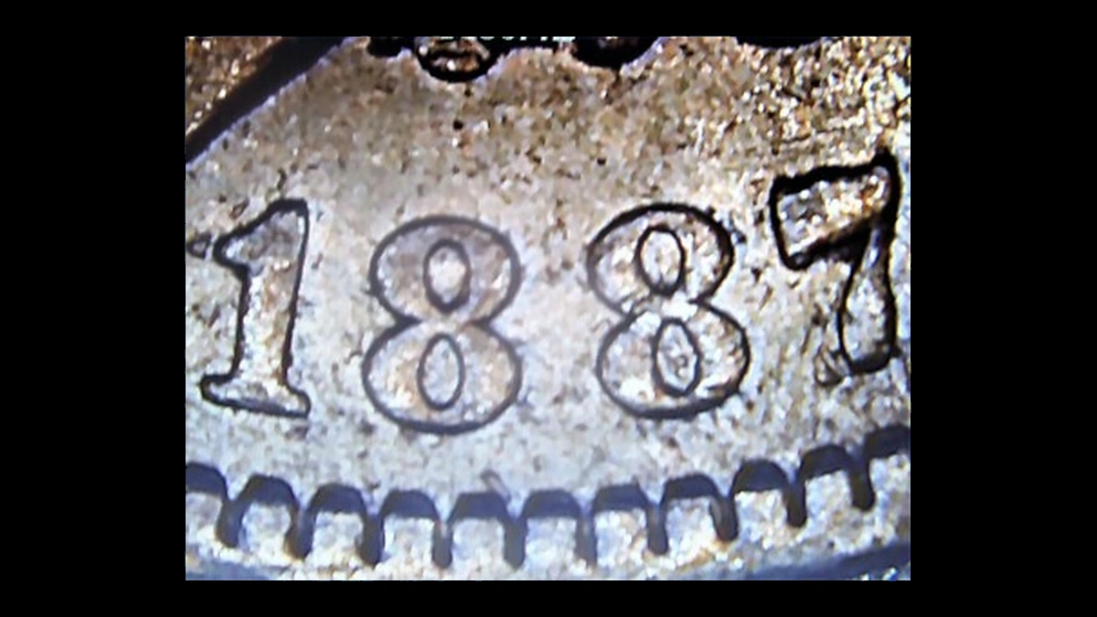 1887 Morgan Dollar: Repunched Date