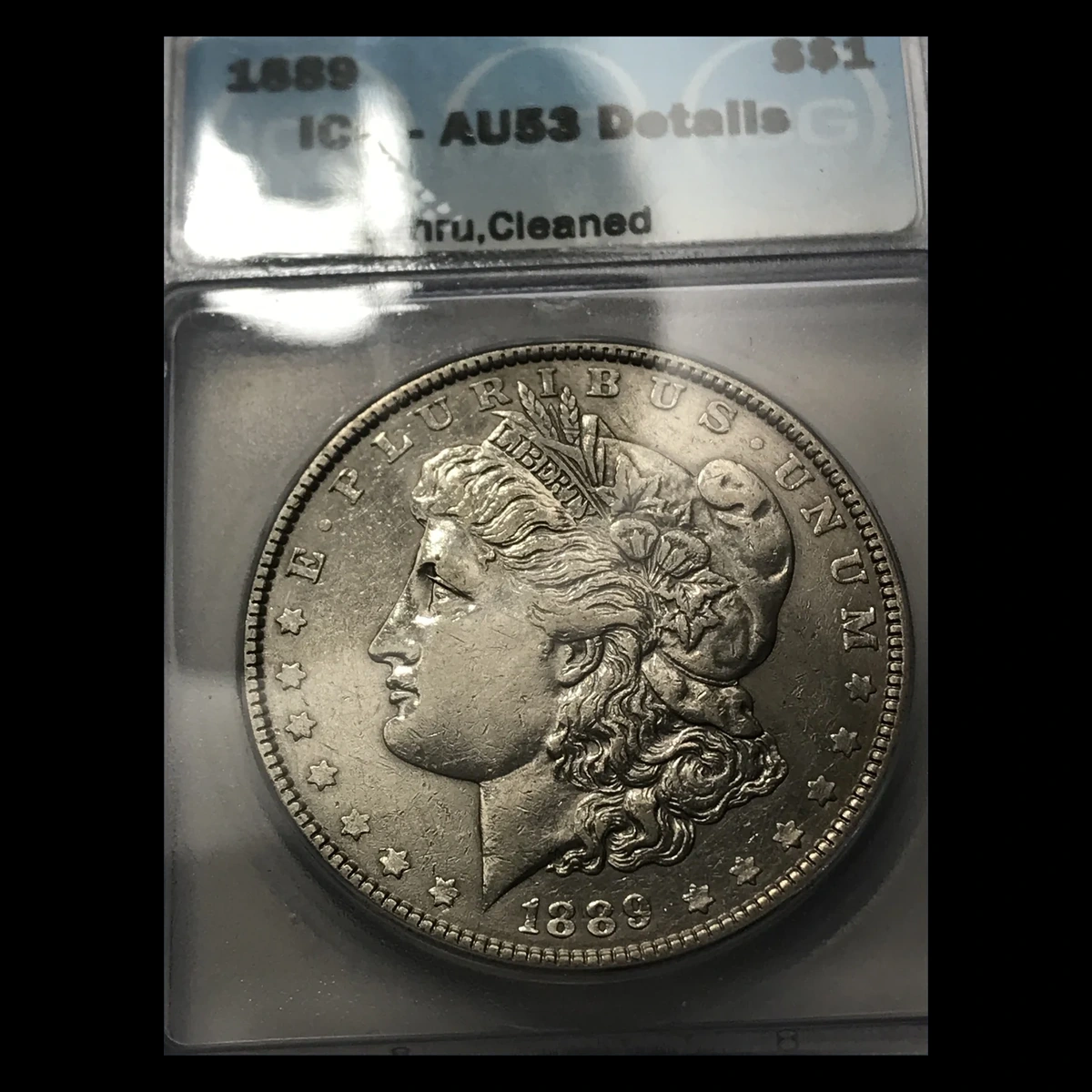 1889 Morgan Dollar: Struck Through